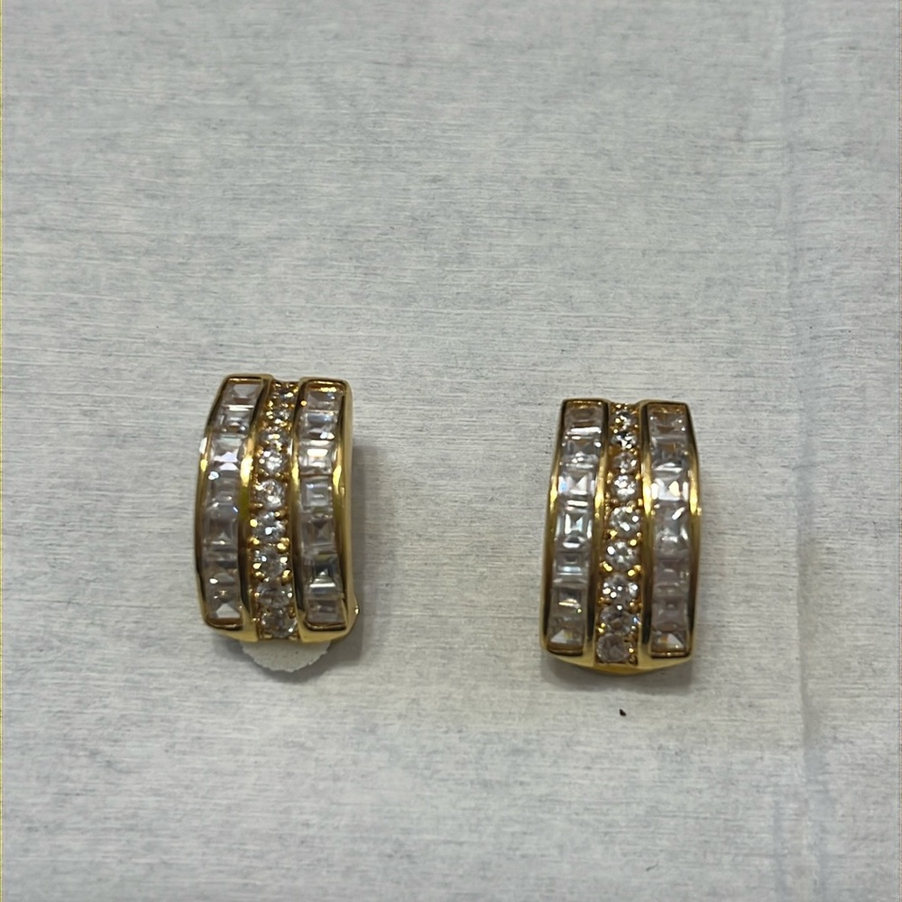 Nolan Muller clip earring , gold plated metal.